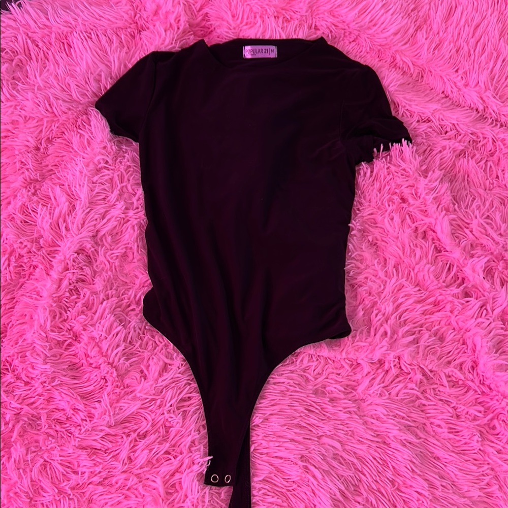 Woman’s Black One Piece Bodysuit